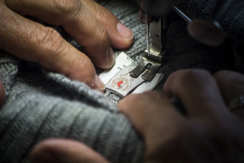 A craftsman at work on an Italy In Cashmere garment